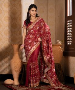 মেরুন কালার সফট চিনিগুড়া সিল্ক ফেব্রিক এমব্রয়ডারি কাজ করা পার্টি শাড়ি।